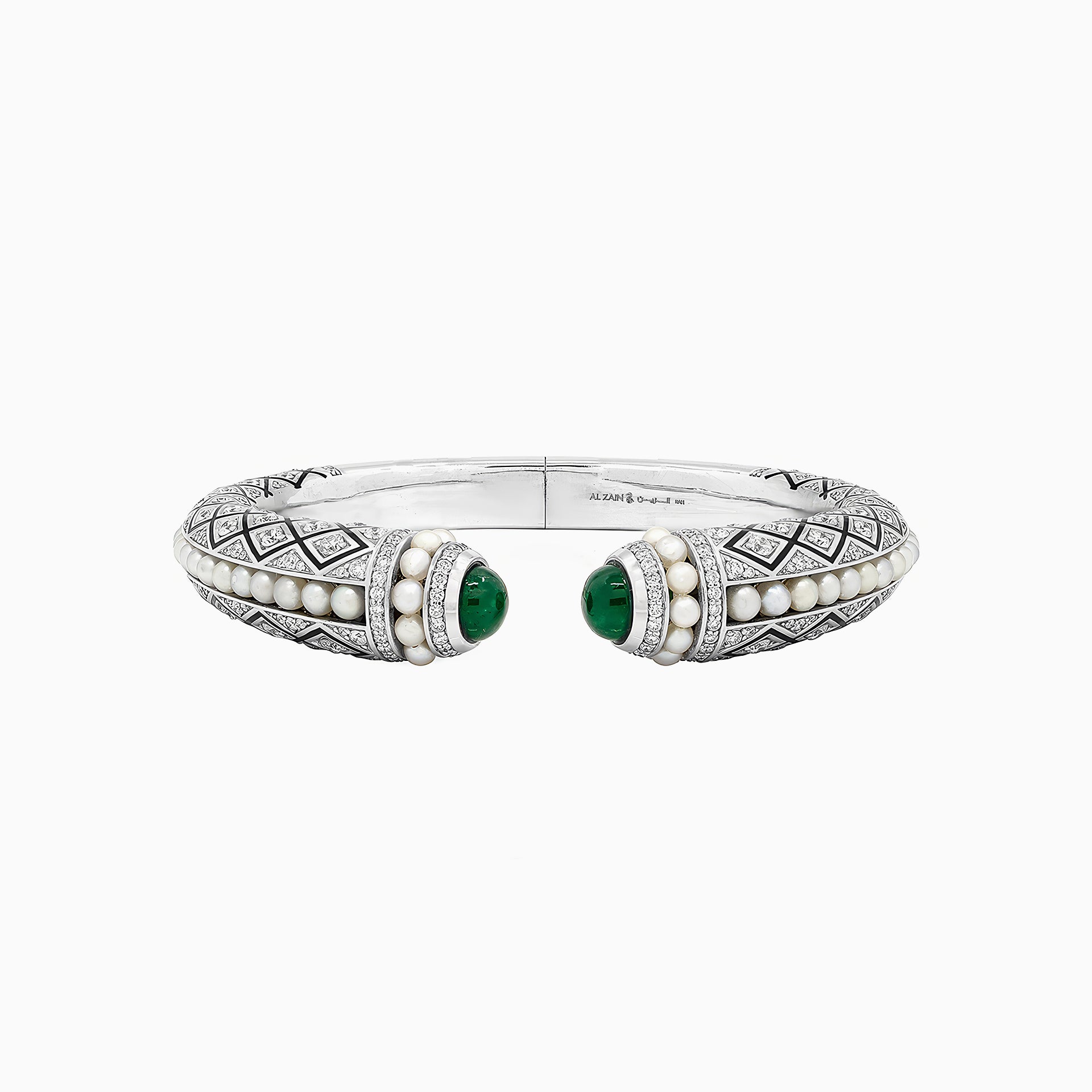 Al Zain Mushaabak 18k white gold clasp bangle with green emerald gemstones set with diamonds and natural Bahraini pearls on a white background
