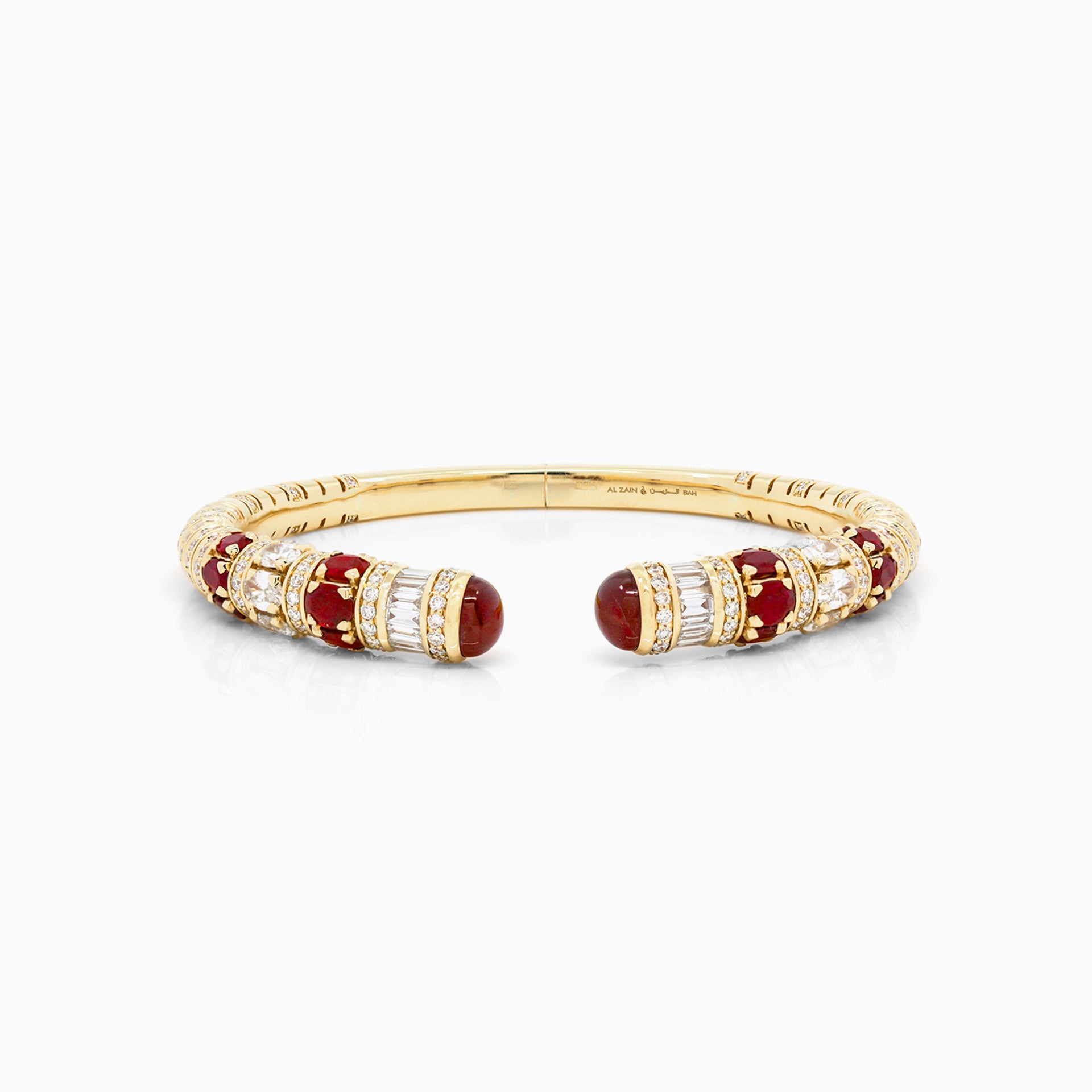 Al Zain Mushabbak 18k yellow gold clasp bangle set with baguette diamonds, natural and red ruby gemstones on a white background.