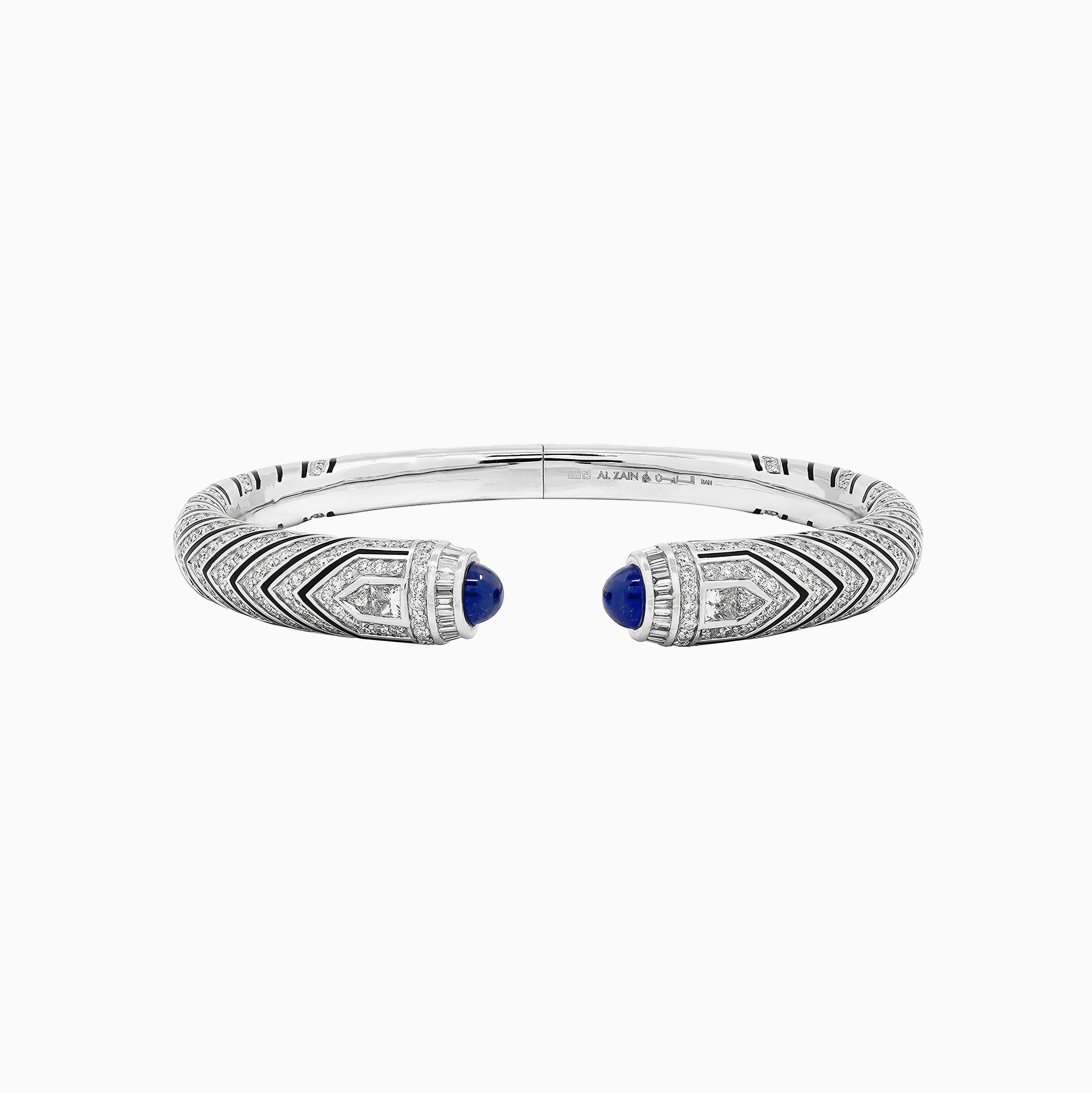 Al Zain Mushaabak white gold bangle with blue sapphire gemstones set with diamonds on a white background