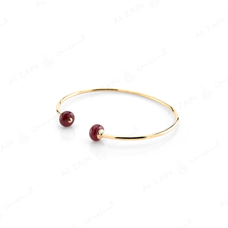 Ruby bead bangle in Yellow Gold